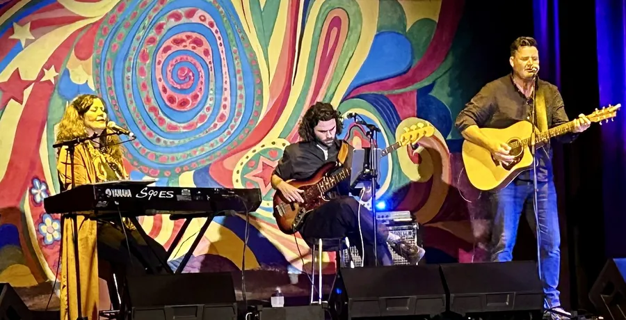 A band performing on stage at Mount Roland Folk Festival