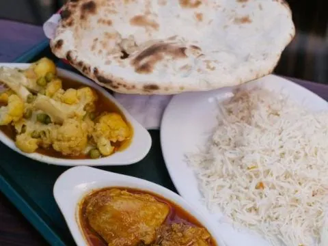Rice, curry and roti served together